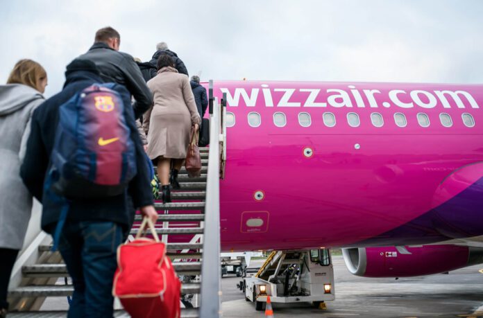 Passengers boarding a wizz air airbus a320 at vilnius airport vno
