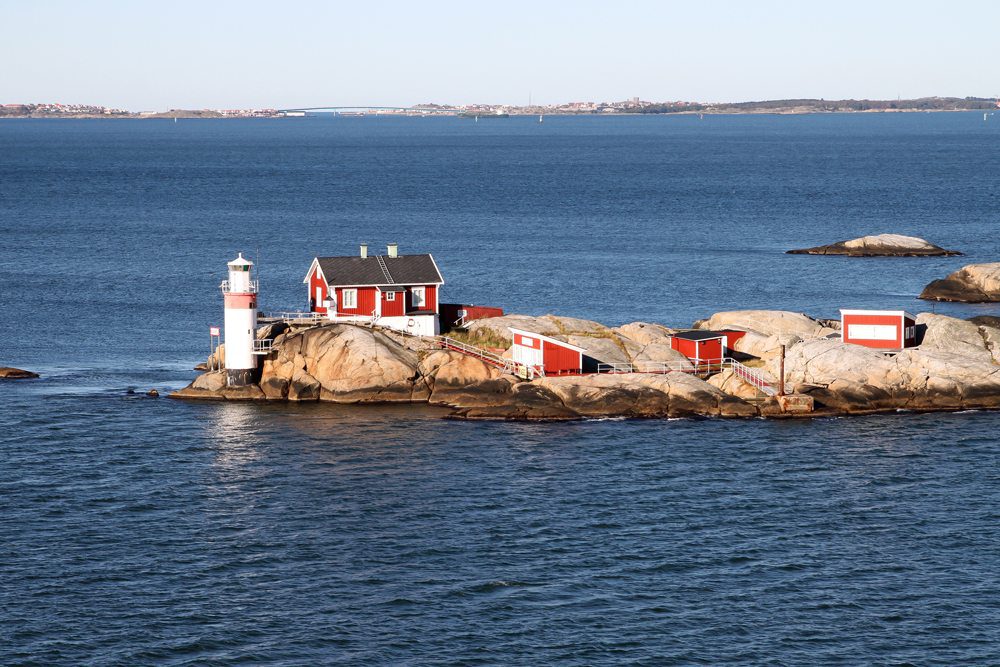Lighthouse and red buildings on small rocky island in gothenburg archipelago on the north sea sweden 545756272